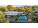 Gorgeous pool with mature trees, patio, and fencing to create a serene outdoor space at 4856 E Cheryl Dr, Paradise Valley, AZ 85253