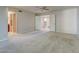 Spacious bedroom area showing an open doorway, leading to an ensuite bathroom and walk-in closet at 4856 E Cheryl Dr, Paradise Valley, AZ 85253