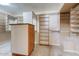 Organized walk-in closet with custom shelving and storage, providing ample space for wardrobe and accessories at 4856 E Cheryl Dr, Paradise Valley, AZ 85253