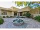 A charming desert landscape and fountain highlight the entrance to this beautiful home at 4856 E Cheryl Dr, Paradise Valley, AZ 85253