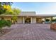 Home with an expansive brick paver driveway and patio at 4856 E Cheryl Dr, Paradise Valley, AZ 85253