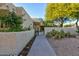 This home welcomes visitors with beautiful desert landscaping and garden features at 4856 E Cheryl Dr, Paradise Valley, AZ 85253
