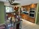 Spacious kitchen with dark countertops, wooden cabinets, stainless steel appliances, and an island at 4856 E Cheryl Dr, Paradise Valley, AZ 85253