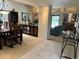 Open concept living room and dining area featuring tile and carpet flooring at 4856 E Cheryl Dr, Paradise Valley, AZ 85253