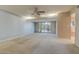 Open living room features a ceiling fan and sliding doors leading to the outdoors, filled with natural light at 4856 E Cheryl Dr, Paradise Valley, AZ 85253