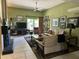 Inviting living room with tile floors, a ceiling fan, and cozy seating at 4856 E Cheryl Dr, Paradise Valley, AZ 85253