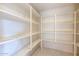 Walk-in pantry features plenty of white shelving at 4856 E Cheryl Dr, Paradise Valley, AZ 85253