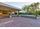 Spacious covered patio with brick pavers and comfortable seating at 4856 E Cheryl Dr, Paradise Valley, AZ 85253