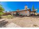Spacious backyard features a brick wall, mature trees, and an open patio area at 5101 W Purdue Ave, Glendale, AZ 85302