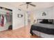 This bedroom boasts a closet, a comfortable bed, and bright natural light at 5101 W Purdue Ave, Glendale, AZ 85302