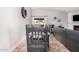 Cozy dining area with gray chairs, a fireplace and view to backyard at 5101 W Purdue Ave, Glendale, AZ 85302