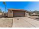 Charming single Gathering home showing a two car garage and low maintenance desert landscaping at 5101 W Purdue Ave, Glendale, AZ 85302