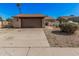 Charming single-story home featuring a brick facade, a two-car garage, and low-maintenance landscaping at 5101 W Purdue Ave, Glendale, AZ 85302