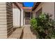 Front entry of the home with desert landscaping and private entry at 5101 W Purdue Ave, Glendale, AZ 85302