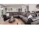 Living room with a large sectional sofa, neutral color palette, and modern decor at 5101 W Purdue Ave, Glendale, AZ 85302
