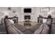 Beautiful living room showcasing a modern fireplace, TV, and comfortable sectional at 5101 W Purdue Ave, Glendale, AZ 85302