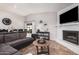 Cozy living room featuring a fireplace, tile flooring, and comfortable seating at 5101 W Purdue Ave, Glendale, AZ 85302