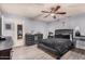 Main bedroom features a wood-look floor, a fan, and an attached desk at 5101 W Purdue Ave, Glendale, AZ 85302