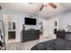 Spacious main bedroom with ceiling fan, ensuite and view to walk-in closet at 5101 W Purdue Ave, Glendale, AZ 85302