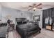Relaxing main bedroom featuring a makeup vanity and wood-look flooring at 5101 W Purdue Ave, Glendale, AZ 85302