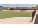 Fenced backyard with grass, patio, and plenty of space at 5102 W Whispering Wind Dr, Glendale, AZ 85310