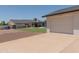 Exterior view of a home featuring a pool, backyard, and a brick facade with a garage and concrete driveway at 5102 W Whispering Wind Dr, Glendale, AZ 85310