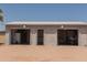 Large garage with three bay doors and space to park your motorcycle at 5102 W Whispering Wind Dr, Glendale, AZ 85310