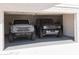 Spacious garage featuring two Ford Broncos, offering ample parking and storage at 5102 W Whispering Wind Dr, Glendale, AZ 85310