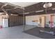 Large garage with home gym equipment, sauna, and plenty of storage space at 5102 W Whispering Wind Dr, Glendale, AZ 85310