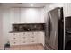 Kitchen features white cabinets, stainless steel appliances and stone countertops at 5102 W Whispering Wind Dr, Glendale, AZ 85310