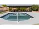 Relaxing backyard pool with a covered patio area, perfect for outdoor entertaining at 5102 W Whispering Wind Dr, Glendale, AZ 85310