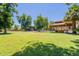 Expansive backyard showcasing mature trees, shed, garage, and gazebo at 5127 W Dobbins Rd, Laveen, AZ 85339