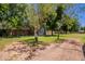 Lush backyard with a shed, offering a serene and spacious outdoor experience at 5127 W Dobbins Rd, Laveen, AZ 85339