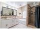 Bright primary bathroom featuring double vanity, soaking tub and tiled shower at 5127 W Dobbins Rd, Laveen, AZ 85339