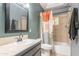 Well-lit bathroom featuring a vanity sink, decorative shower curtain, and stylish accents at 5127 W Dobbins Rd, Laveen, AZ 85339
