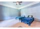 Inviting bedroom with two twin beds, ceiling fan, and tray ceiling for a cozy retreat at 5127 W Dobbins Rd, Laveen, AZ 85339