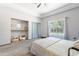 Bright bedroom showcasing large closet, window and neutral tones for a serene atmosphere at 5127 W Dobbins Rd, Laveen, AZ 85339
