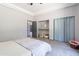 Neutral bedroom with a ceiling fan, closet, and soft carpet for a relaxing space at 5127 W Dobbins Rd, Laveen, AZ 85339