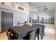 Open dining area with tile floors, light gray color scheme and views of adjacent room at 5127 W Dobbins Rd, Laveen, AZ 85339