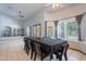 Dining room with tile floors and several windows at 5127 W Dobbins Rd, Laveen, AZ 85339
