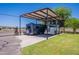 Property with RV parking under a metal awning at 5127 W Dobbins Rd, Laveen, AZ 85339