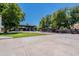 Spacious yard and exterior showcasing a covered parking area and manicured lawn at 5127 W Dobbins Rd, Laveen, AZ 85339
