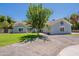 Charming single-story home with lush landscaping and a well-maintained lawn at 5127 W Dobbins Rd, Laveen, AZ 85339