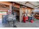 View of the garage area with work tables, cabinets, and fire extinguisher at 5127 W Dobbins Rd, Laveen, AZ 85339