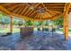 Enjoy outdoor living in this gazebo with ceiling fans, outdoor kitchen, and comfortable seating for relaxation and entertainment at 5127 W Dobbins Rd, Laveen, AZ 85339