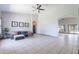 Open-concept living area featuring tile flooring, vaulted ceiling, and contemporary decor at 5127 W Dobbins Rd, Laveen, AZ 85339