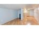 Spacious living room with hardwood floors that leads to a carpeted staircase at 5127 W Dobbins Rd, Laveen, AZ 85339