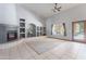 Bright living space with tile flooring, fireplace, and shelving at 5127 W Dobbins Rd, Laveen, AZ 85339