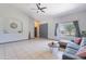 Bright living room featuring a neutral color scheme and tiled flooring at 5127 W Dobbins Rd, Laveen, AZ 85339