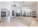 Open living room with fireplace, tile floors, and adjacent entry at 5127 W Dobbins Rd, Laveen, AZ 85339
